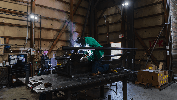 A worker at a fabrication plant